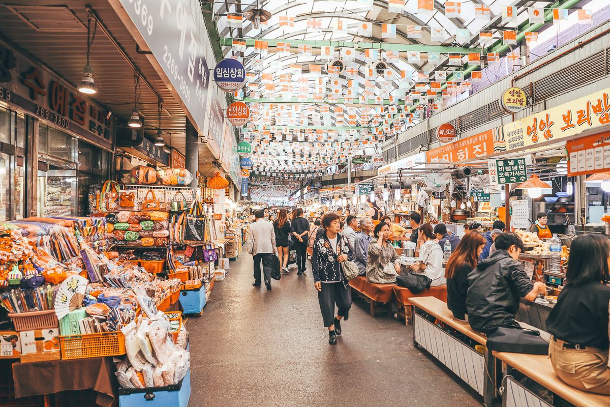 A traditional market stall with multilingual signage